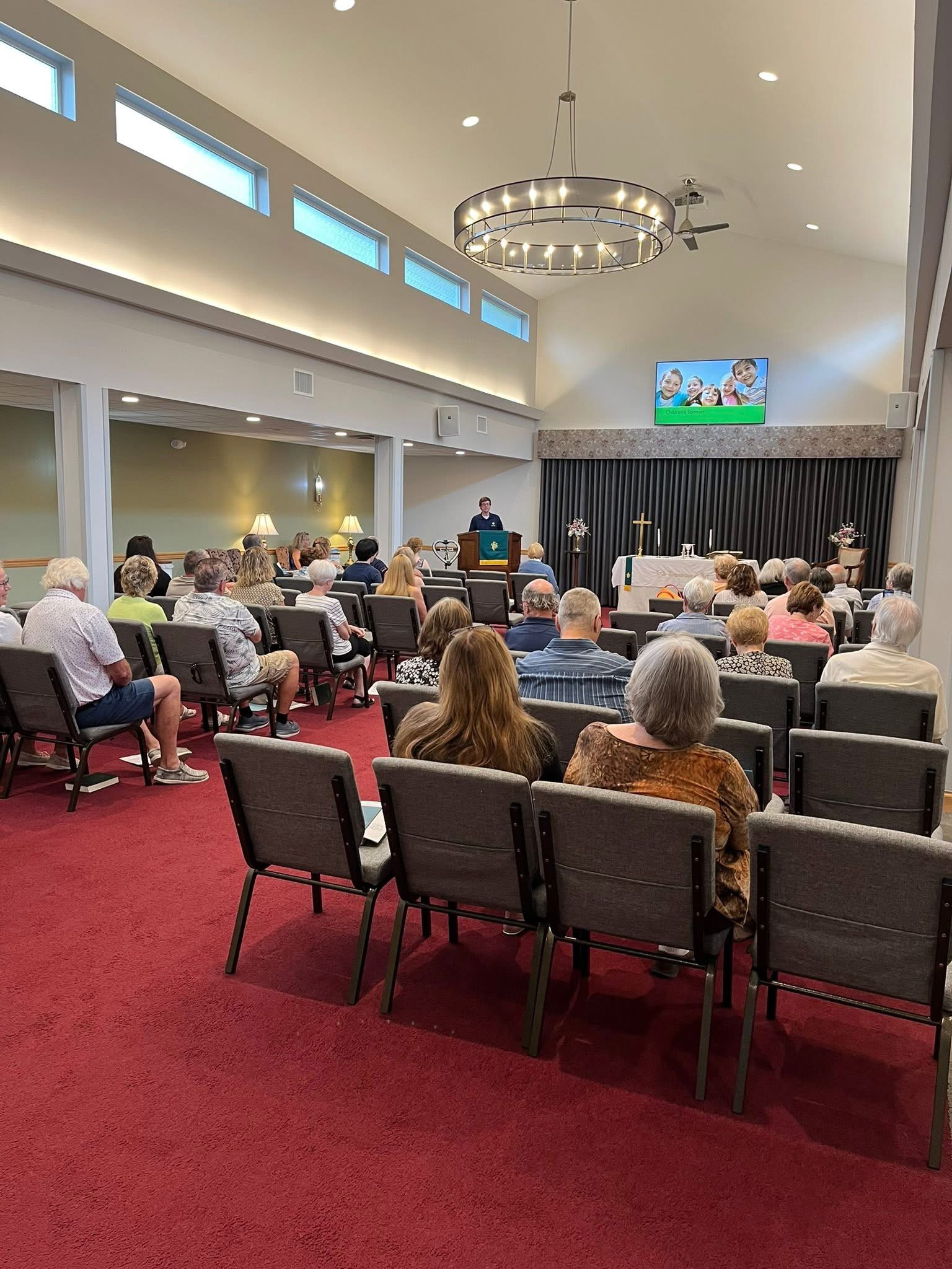 A candle in a church setting.